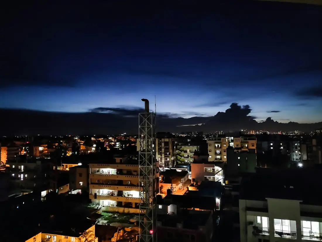 Bengaluru at dusk, city lights coming on
